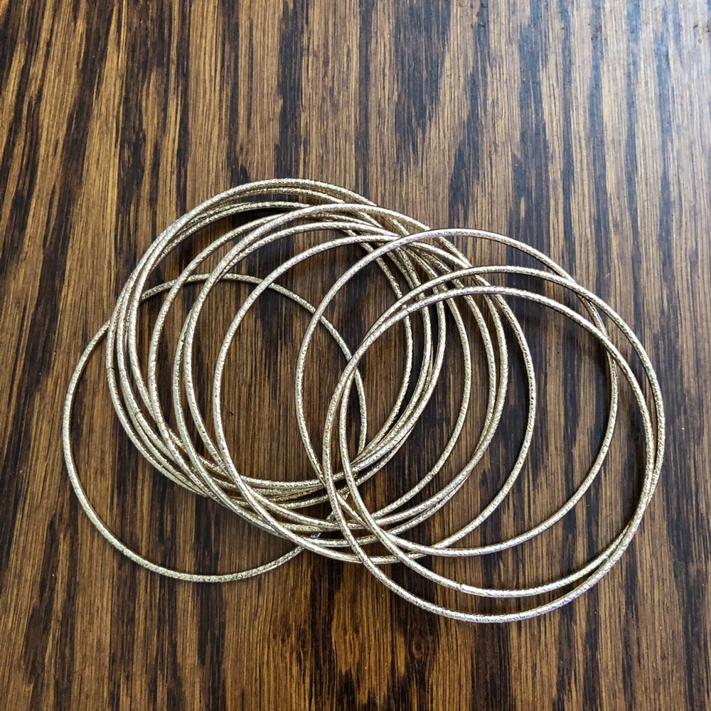 Twelve Skinny Gold Bangles
